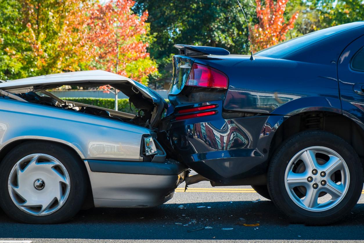A rear-end collision between two cars