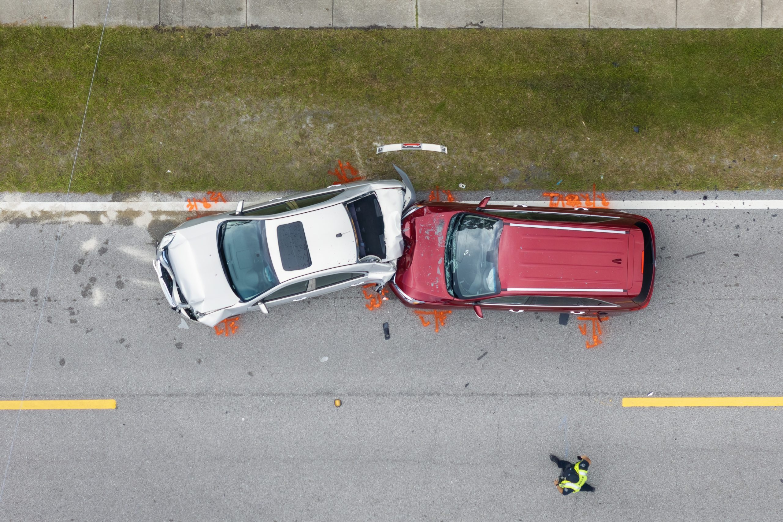 Prevention and Safety Tips for Avoiding Rollover Accidents Aerial view of a car accident after a red SUV rear-ended a white car